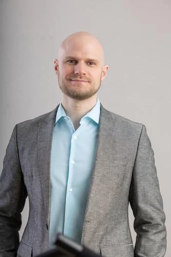 Ben Smith, PA, in a grey blazer and light blue shirt