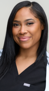 Portrait of Sheneka Marcano, MSN, FNP-BC, in black scrubs
